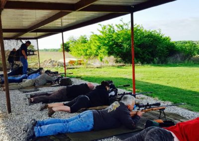 People laying down shooting long range rifles at Fossil Point Sporting Grounds